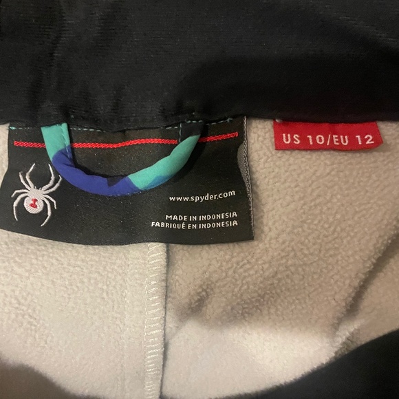 Spyder Orb softshell ski pants with a geometric blue and green pattern - Picture 3 of 3